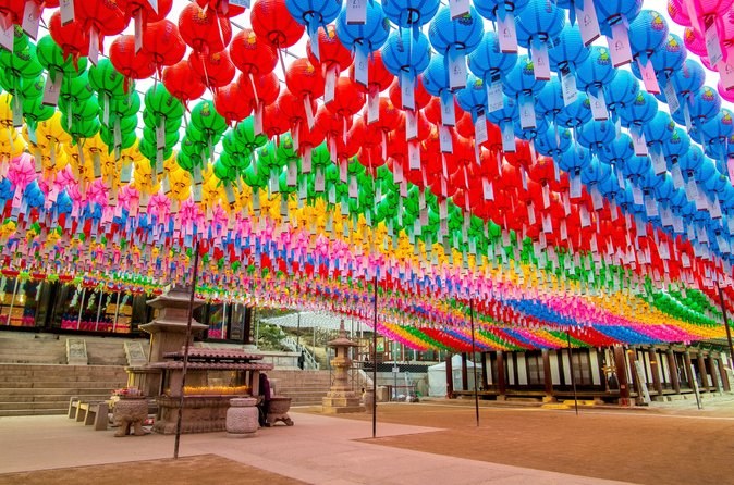 Rows of coloured lotus lanterns strung across the courtyard at Jogyesa Temple